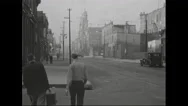 1940S: People Leisurely Strolling On A Serene City Street Adorned With Charming Stock Footage