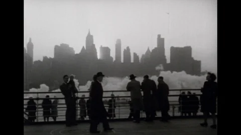 1940s: People stand on deck of boat with New York in background. Ocean liner Stock Footage