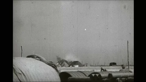 1940s: Plane falling from the sky, crashes and explodes. People sifting through Stock Footage 166582961