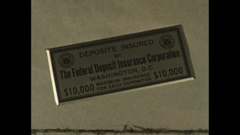 1940s: Plaque declares FDIC insurance. Teller hands passbook back to a woman. 스톡 동영상 280688310