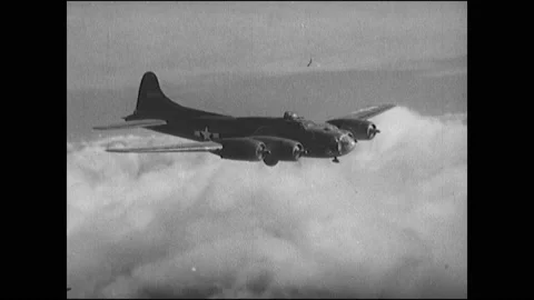 1940s: Propellers on bomber plane slow. Airmen panic and talk in cockpit. Men Stock Footage 138338687