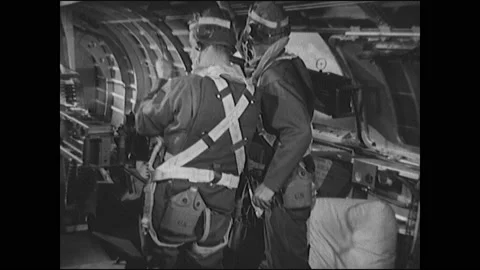1940s: Propellers on bomber plane slow. Airmen panic and talk in cockpit. Men Stock Footage 138914920