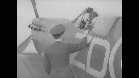 1940s - An RAF pilot disembarks from his Spitfire at a Fighter Command Station, Stock Footage 159136895