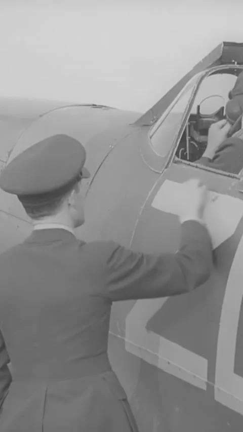 1940s - An RAF pilot disembarks from his Spitfire at a Fighter Command Station, Stock Footage 287577470