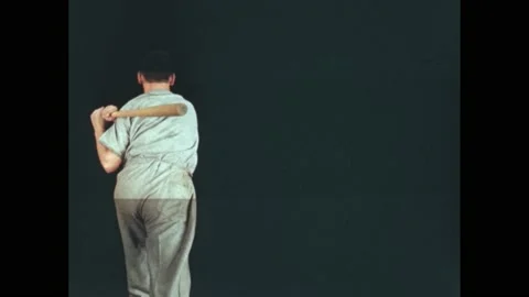 1940s: Rear view, baseball player swinging bat. Clapboard. Slow motion, player Stock Footage 168263434