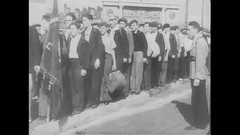 1940s - Russian men sign up to join the army while other men mine, still others 動画素材 124506568