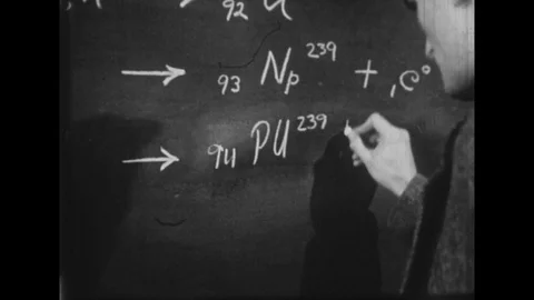 1940s: Scientist writing on chalk board, Scientists talking 動画素材 74724374