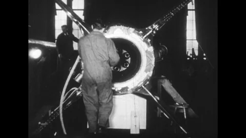 1940s: Scientists build a rocket and weapons. Stock Footage