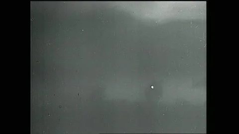 1940s: Shockwave radiates from atomic explosion. Text placard. Ring cloud and Stock Footage 153551769
