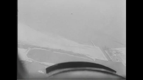 1940s: Skilled pilot expertly maneuvers the plane, offering breathtaking aerial Stock Footage 156869393