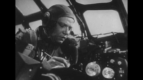 1940s: Soldier in plane speaks into radio / Pilot with radar equipment / Soldier Stock Footage