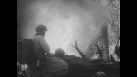 1940s: Soldier using flamethrower / Close up, soldier with bazooka / Flames in Stock Footage 74430632