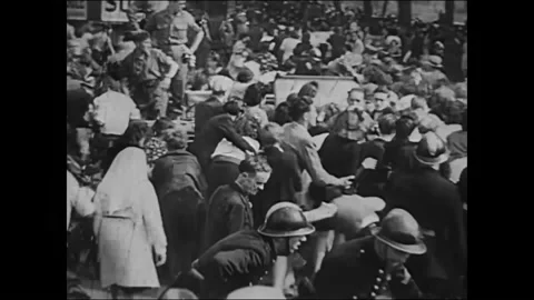 1940s: soldiers shooting into upper windows of buildings, Parisian citizens Stock Footage 167083572