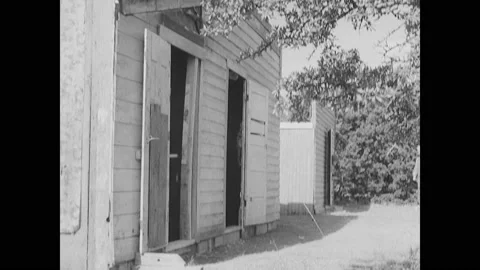 1940s: Soldiers sit watching training demonstration. Soldier moves from building Stock Footage 150349877