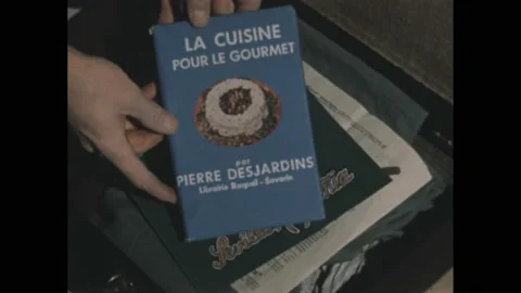 1940s: Spanish and French books, a Spanish menu and a German newspaper in a Stock Footage