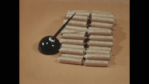1940s: Stack of rolls of pennies next to a pen in a holder. Hundred dollar bill Stock Footage 238929940