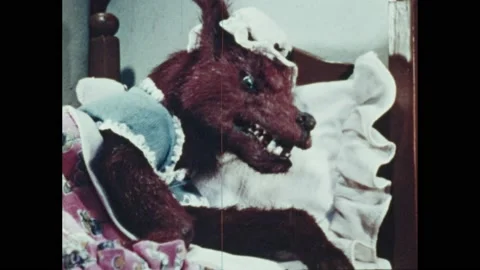 1940s: Stop-motion- Wolf runs up stairs after girl. Man with rifle and old woman Stock Footage 205764704