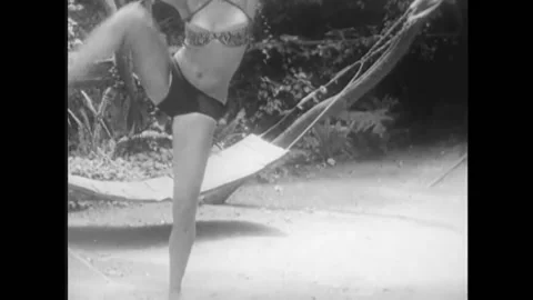 1940s - A stripper named Sheree performs a routine in her backyard. 스톡 동영상 170511280