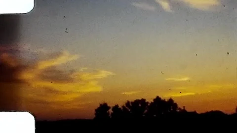1940s sunset clouds. Vintage 8mm Home Video. Stock Footage 253662094