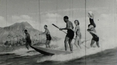1940s Surfers Ride Surf Board Ocean Waves SURFING Hawaii Vintage Film Old Movie Stock Footage