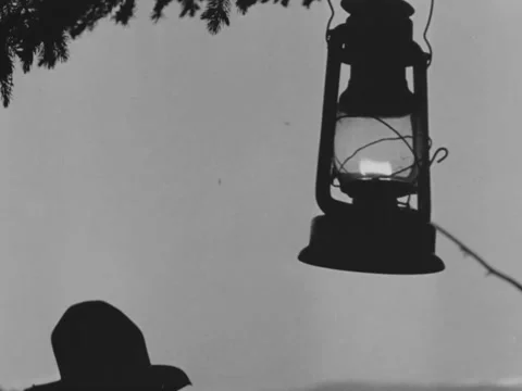 1940s: Swinging lantern Stock Footage 229365004