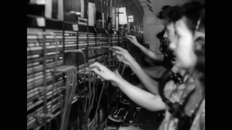 1940s - Switchboard operators connect calls at an atomic power plant. Stock Footage 159136747