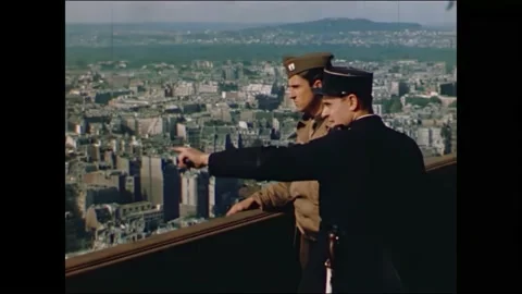 1940s: taking elevator up Eiffel Tower, overlooks of Paris from the top of Stock Footage 167083599