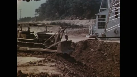 1940s - Tennessee Valley Authority dump trucks, power shovels and bulldozers are Stock Footage 246296406