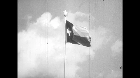 1940s: Texas flag, students taking notes in class, people going into mission at Stock Footage 127732372