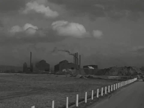 1940s: Tracking shot of factory down rural road Stock-Footage 231931756