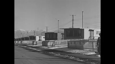 1940s - A trading post and other buildings and road signs are seen on the US Stock Footage 229353573