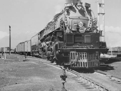 1940s: Train pulls into station Stock Footage 231262531