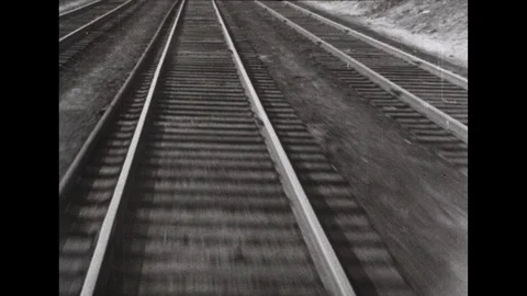 1940s: Train roars down the track. Diesel cab with dials and gauges and Stock Footage 113940627