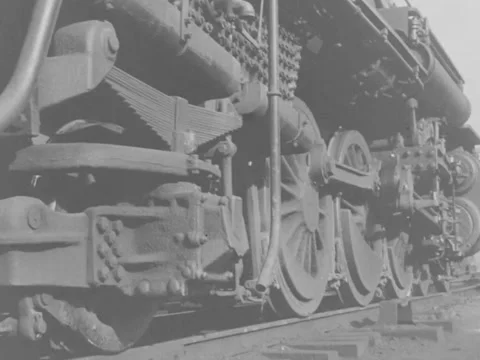 1940s: Train wheels on track Stock Footage 158175504