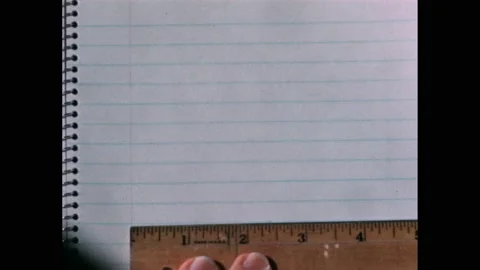 1940s: turning page off of math equations and drawing two lines forming right Stock Footage 167182719