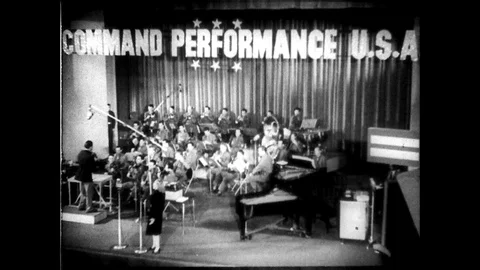 1940s: UNITED STATES: Command Performance USA event. Lady bows to audience. Lady Stock Footage 89767326