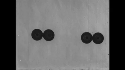 1940s: UNITED STATES: four objects on table. Milk man and two legs. Man delivers Stock Footage 127731158