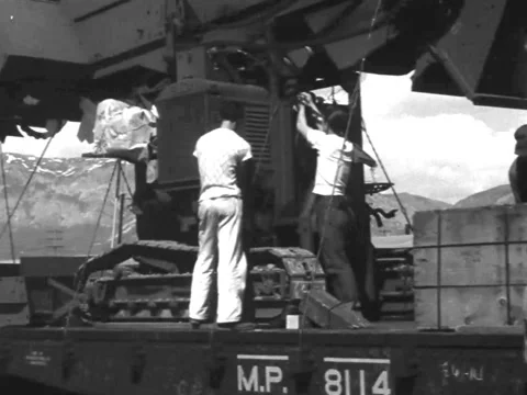 1940s: Unloading large machines from train Stock-Footage 231718106