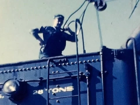 1940s Video of an Engineer Loading Coal Into a Steam Locomotive Tender 動画素材 335896240
