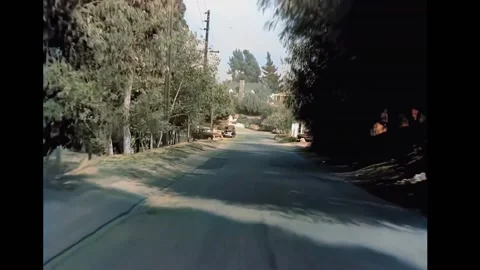 1940s - View from a car turning onto a main road from a California suburb. Stock Footage 241808720