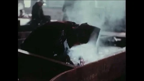 1940s - Welders work on a ship. Stock Footage 86407358