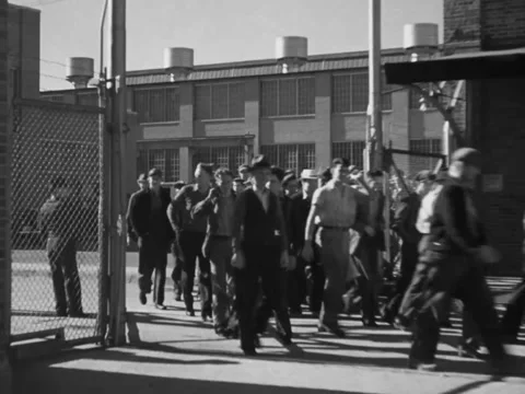 1940s: Workers exiting factory 스톡 동영상 229738690
