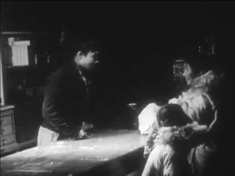 1941 _An Eskimo woman trades a basket for needles at a trader’s store, shots of Stock Footage