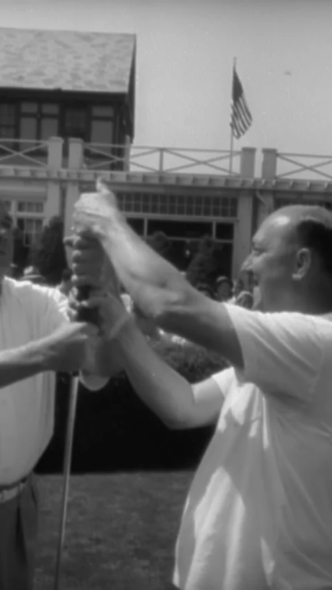1941 - Babe Ruth and Ty Cobb compete in a benefit golf match at Fresh Meadows Stock Footage 284136478