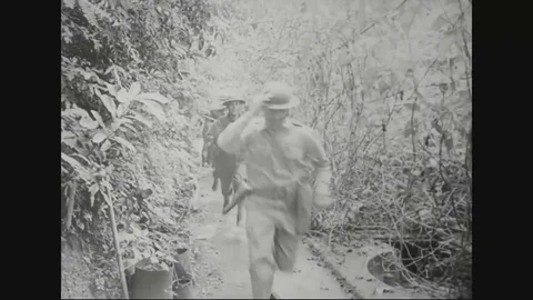 1941 - General Jonathan Wainwright looks at a map and soldiers rush to Stock Footage 82803163