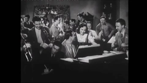 1941 - In this musical, a man playing harmonica (Jimmy Stewart) interrupts a Stock Footage 155799232