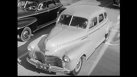 1941 - A remote control lever makes it easier for a driver to put their car in Stock Footage 143837237