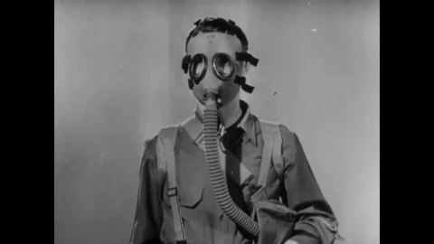1941 - A soldier demonstrates how to check a gas mask for gas, and how to ensure Stock Footage 88897670