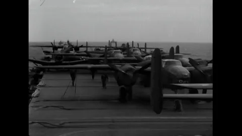 1942 - A flight of B-25s on deck of the USS Enterprise, Colonel Doolittle Stock Footage 111236360