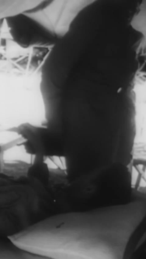 1942 - General MacArthur decorates a wounded war correspondent in New Guinea, Stock Footage 287570362